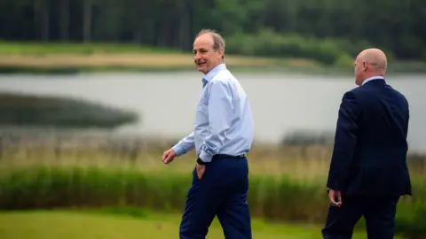 PACEMAKER Taoiseach Micheal Martin took an early morning stroll at Lough Erne Resort ahead of the Summit