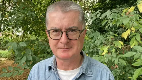 PA Media Dr Patrick Waterson