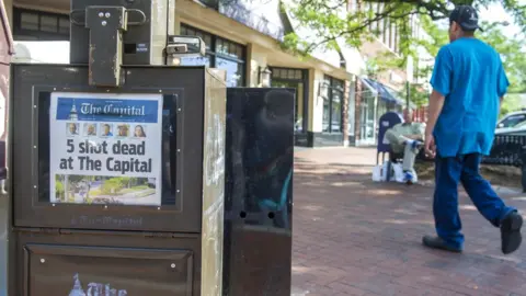 EPA the Capital Gazette newspaper on sale the day after the shooting