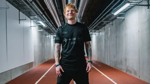 Ipswich Town Football Club Ed Sheeran in Ipswich Town blackout kit