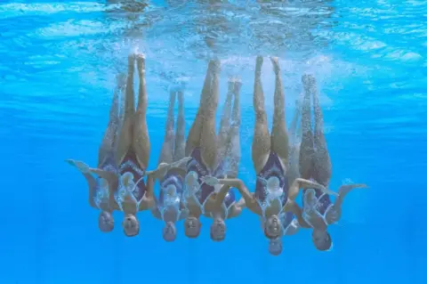 AFP Egypt's team competes in the preliminaries for the women's team technical artistic swimming event during the Budapest 2022 World Aquatics Championships at the Alfred Hajos Swimming Complex in Budapest on 19 June.