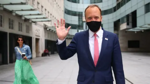 Getty Images Matt Hancock with Gina Coladangelo outside BBC