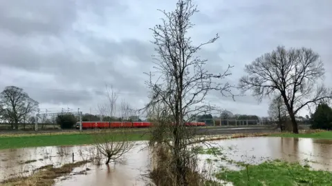BBC Weather Watchers/ Jeff Stevens A field floods in Swynnerton, Staffordshire