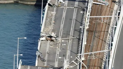 Reuters Damaged bridge at Kansai airport