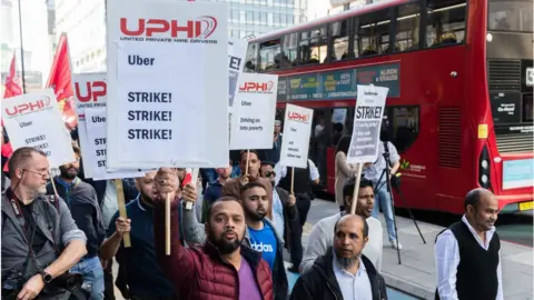 Barcroft Media Uber drivers on strike in London in October demanding employment rights