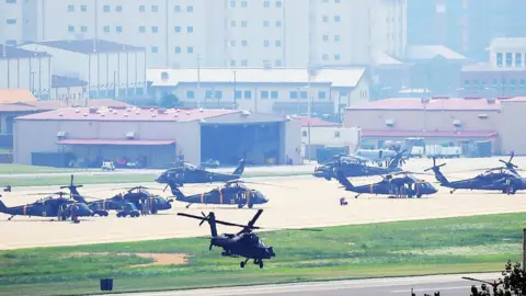 EPA An Apache helicopter takes off from US base Camp Humphreys in Pyeongtaek, south of Seoul, South Korea, 5 August 2019