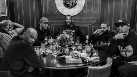 Simon Peter Green Wu-Tang Clan at a dinner table