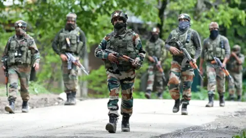 Getty Images Indian army soldiers engaged in anti-militant operations south of Srinigar in Indian-administered Kashmir in May 2017