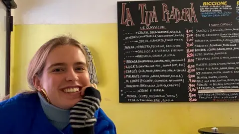 Hilary Nicholls Clarissa Nicholls in a cafe