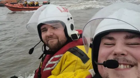 Laura Morgan Chris with one of his colleagues on a boat