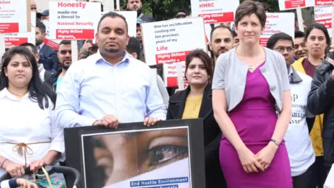 Alison Thewliss Alison Thewliss with members of the Highly Skilled Migrants group at a recent protest