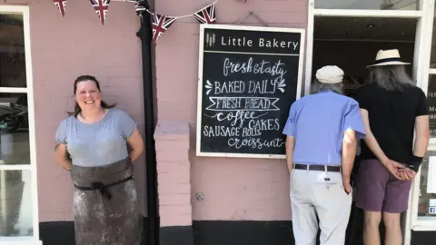 BBC Mel Rodber outside her bakery