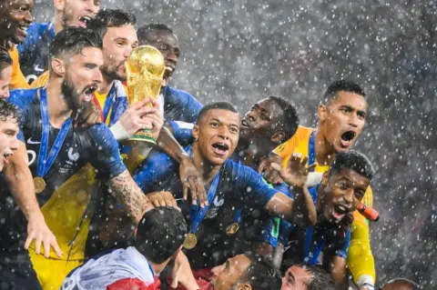 Getty Images France's players lift the World Cup trophy after winning the Russia 2018 World Cup final football match between France and Croatia at the Luzhniki Stadium in Moscow on July 15, 2018.