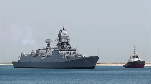 Getty Images Indian Navy Warship INS Kolkata arrives at Hamad Port during the Doha International Maritime Defence Exhibition & Conference (DIMDEX) in the Qatari capital Doha on March 20, 2022.