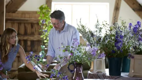 Shane Connolly Shane Connolly arranging purple flowers for the Coronation