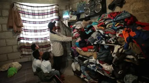 Reuters Facundo Martinez turns the television on for a televised class for his children as millions of students returned to classes virtually after schools were ordered into lockdown in March, due to the coronavirus disease (COVID-19) outbreak, in Chilcuautla, Hildalgo state, Mexico August 24, 2020.