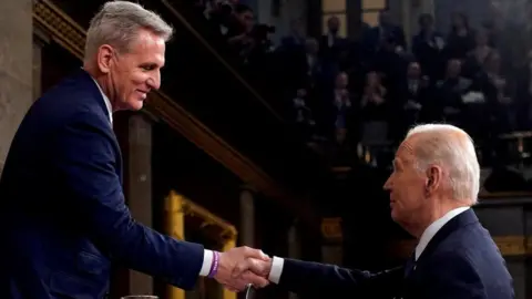 Reuters McCarthy and Biden shake hands at the State of the Union address