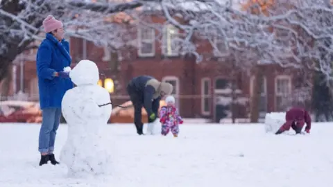 Alamy People playing in snow in Liverpool