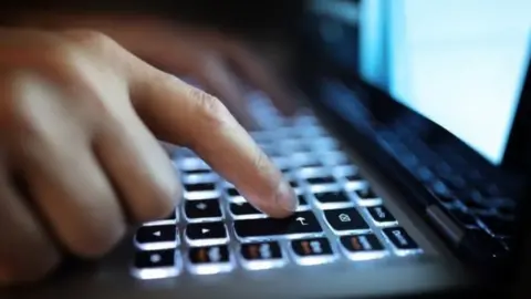 Thinkstock typing on keyboard