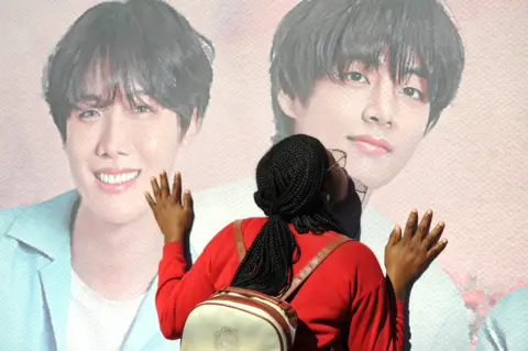 BBC Fan kisses poster of BTS