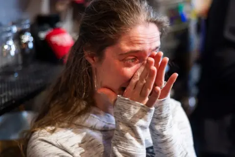 European Press Agency Iowa voter Lisa Newgard tearful listening to Haley speak