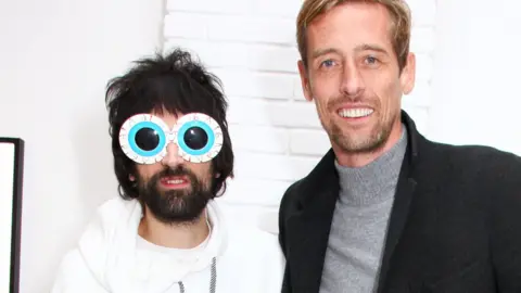 Getty Images Pizzorno and Peter Crouch, pictured at the musician's Daft Apeth art exhibition in 2018