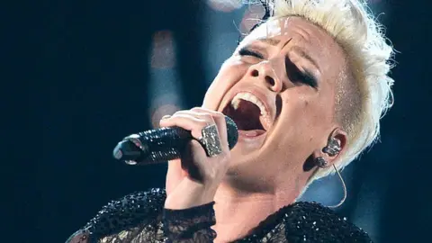 Getty Images Pink performs onstage during the 56th GRAMMY Awards