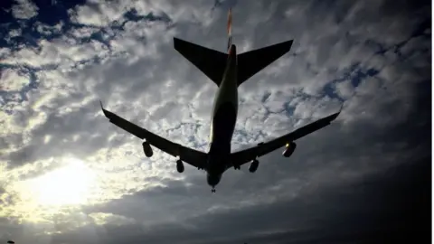 Getty Images Plane lands at Heathrow