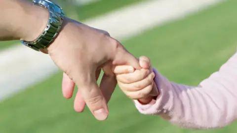 Thinkstock Child and adult hold hands