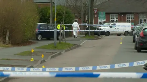 Police and police tape in Caldwell Road