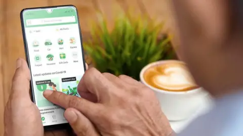 Grab Man using Grab app.