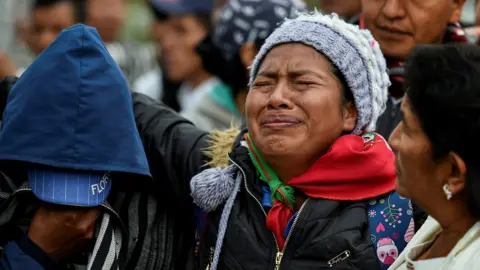 Getty Images Indigenous people attend the funeral of five indigenous guards killed during an attack by suspected rebels in Tacueyo, rural area of Toribio, department of Cauca, Colombia, on October 31, 2019.