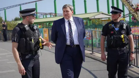 Essex Police Kit Malthouse and two Essex police officers in Southend