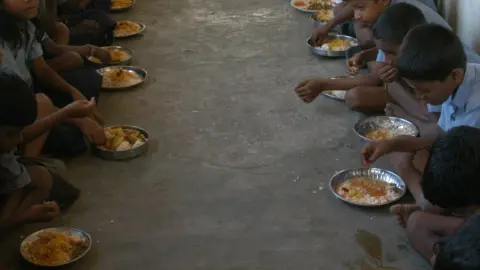 Getty Images Distributing Mid Day Meal to Primary School students (Corporation School Children) in Chennai, Tamil Nadu, India