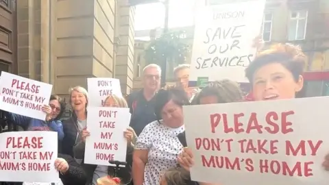 Gemma Dillon/BBC Protestors outside the Town Hall, Huddersfield