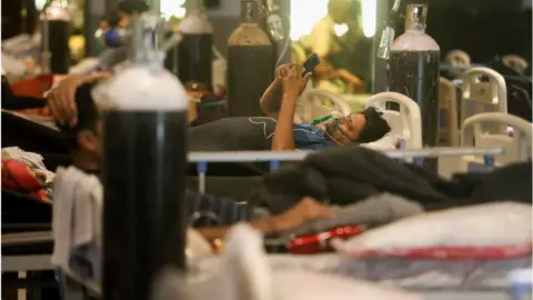 Getty Images A Covid-19 infected patient receiving medical oxygen for breathing comfortably seen inside a Covid-19 care centre,
