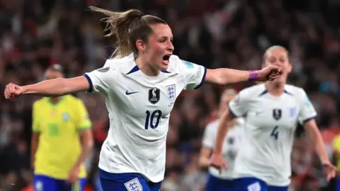 PA Media England's Ella Toone celebrates scoring their side's first goal of the game during the Women's Finalissima at Wembley Stadium, London