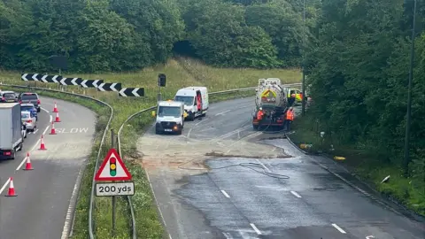 BBC The leftover debris and fuel on the M32 carriage