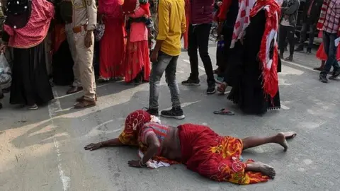 Getty Images Relatives of people arrested by police for being allegedly involved in child marriages, during Assam government's state-wide crackdown on child marriages, react after police baton charge to control to protesting relatives outside Mayong police station in Morigaon district of Assam on February 4, 2023.