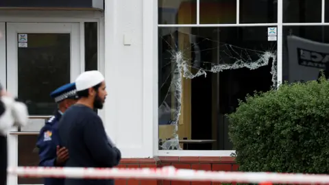 Reuters Smashed windows at Linwood mosque