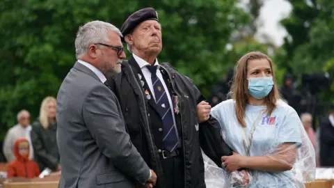 PA Media A Normandy veteran and his family at the National Memorial Arboretum