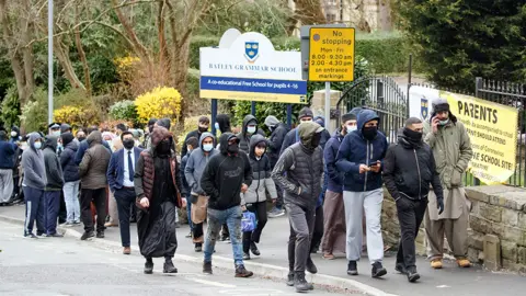 PA Media Protestors outside school