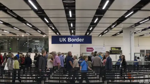 Getty Images Passport control at Gatwick Airport