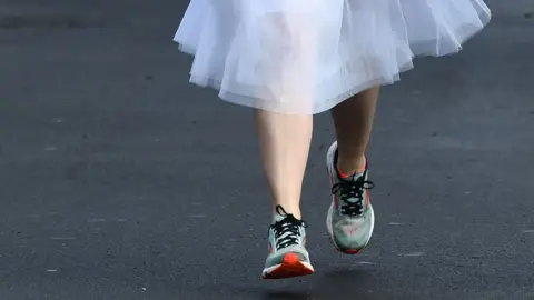 Wales news service Trainers under wedding dress