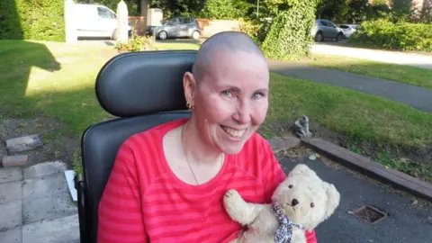 Hansons Auctioneers Angela Underhill with her bear Ermentrude