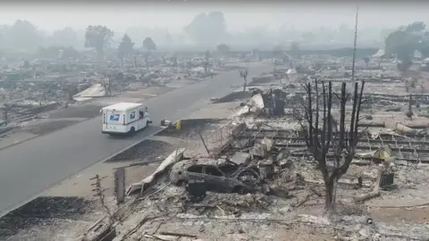 Reuters A postman delivers mail in a fire-devastated suburb of Santa Rosa, California