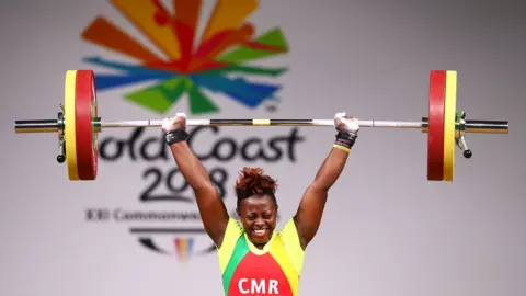 Getty Images Arcangeline Fouodji Sonkbou of Cameroon competes during the Women's 69kg final of Weightlifting on day four of the Gold Coast 2018 Commonwealth Games, Australia, April 8, 2018