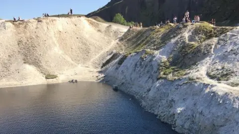 Derbyshire Fire and Rescue Service People looking at quarry pool