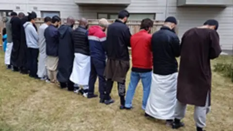 Police handout Photo of men at the barbecue
