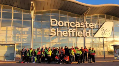 Staff on the last day at Doncaster Sheffield Airport